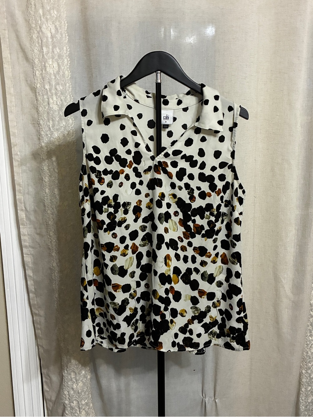 CAbi Sleeveless Collared Animal Print Blouse in White and Black